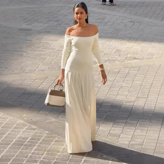 Dress woman – off-shoulder – fitted waist – long sleeves – pleated maxi skirt